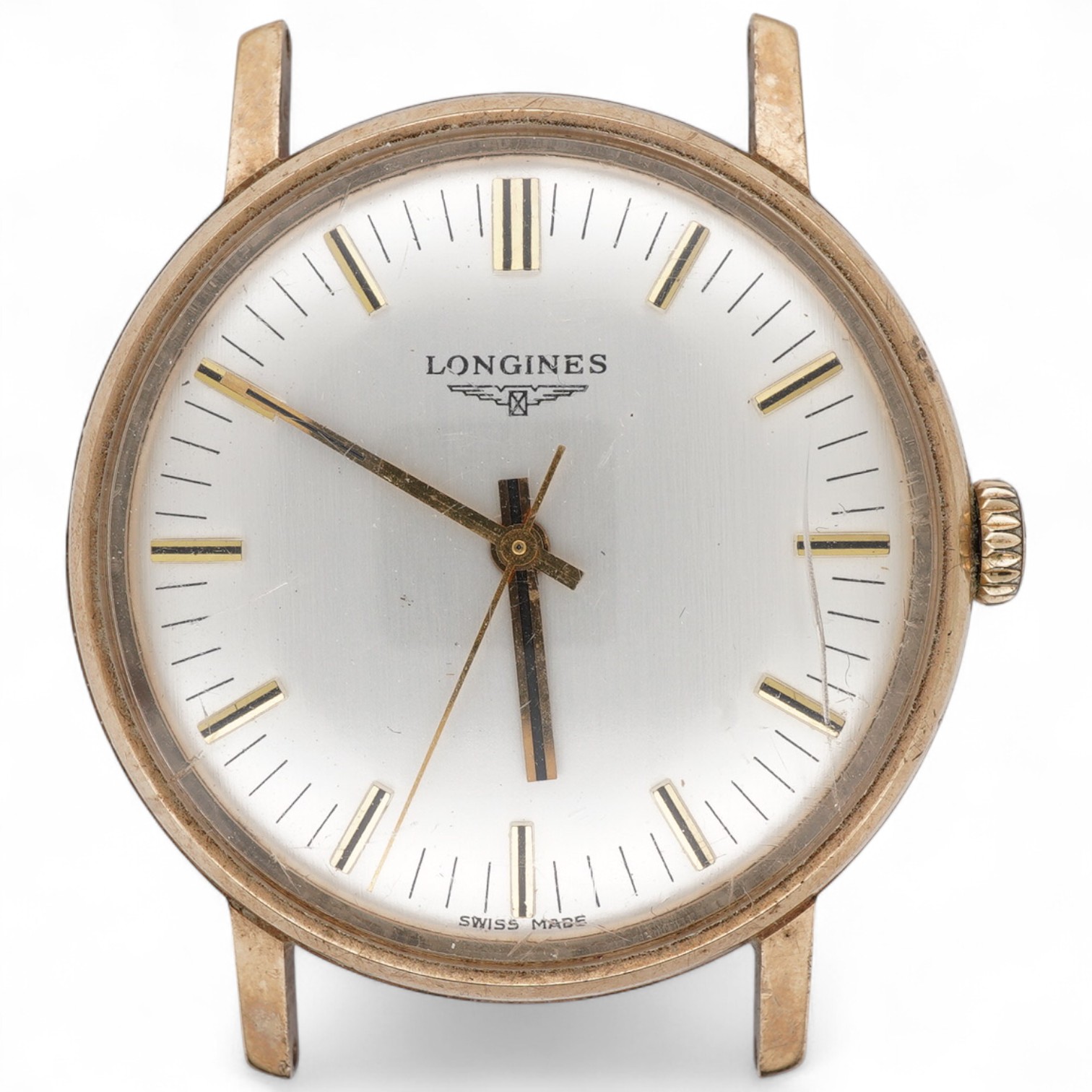 A gentleman's early 1980's 9ct gold Longines manual wind wrist watch, with baton numerals and case back inscription, case diameter 33mm, no strap. Longines watch